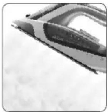 Close-up of a train iron in flight against a cloudy sky (no visible text or symbols)
