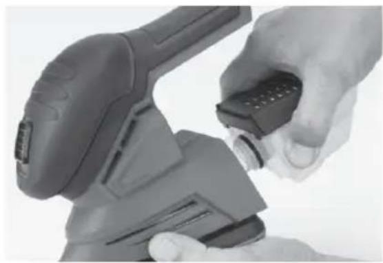 Close-up of a hand using a handheld device to adjust or install a component (no visible text or symbols)