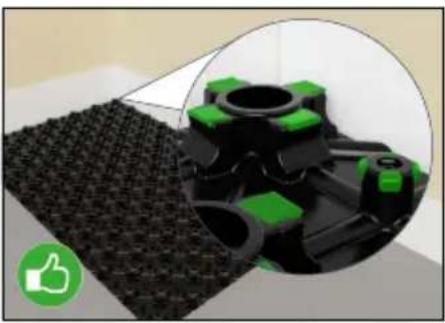 Close-up of a black textured surface with green mechanical components, showing a circular inset view (no text or symbols)