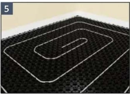 Abstract pattern of nested oval shapes on a black textured background, no text or symbols present