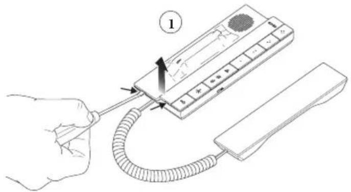 Diagram showing a hand holding a cable with a device labeled '1' and directional arrows indicating connection or movement.