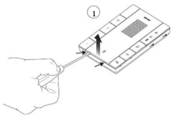 Diagram showing a hand holding a screwdriver inserted into a device with an arrow indicating direction, labeled with number 1.