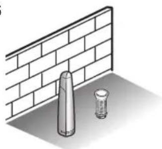 Illustration of a cylindrical object and a bulb placed on a brick wall (no text or symbols)