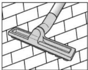Diagram of a hand cleaning a tiled wall with a mounted component (no text or symbols)