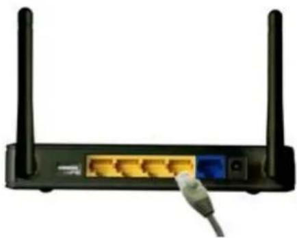 Front view of a black wireless router with two antennas and a USB cable inserted (no visible text or symbols)