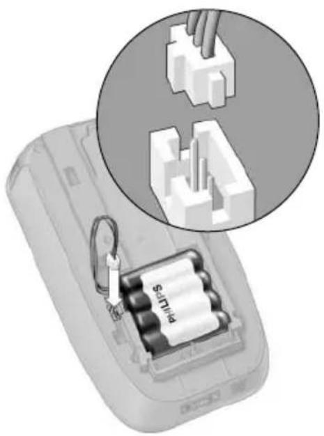 Diagram of a battery pack with a hand inserting a component, showing internal components and a magnified view (no text or symbols)