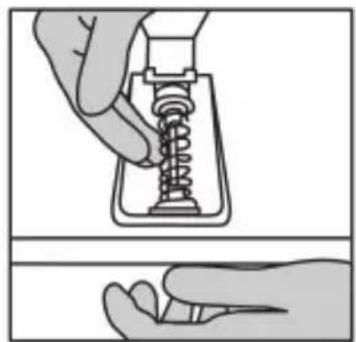 Illustration of a hand holding a spring-loaded mechanical component, no text or symbols present