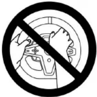 Prohibition sign with crossed hands and a circular background showing a car wheel, indicating no manual or mechanical use.