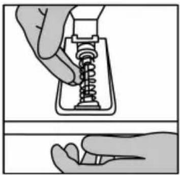 Illustration of a hand holding a spring-loaded component, showing mechanical assembly (no text or symbols).