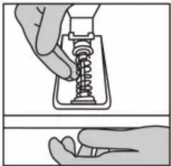 Illustration of a hand holding a spring-loaded component, showing mechanical assembly, without text or symbols.