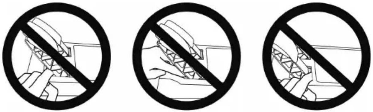 Three black-and-white prohibition signs showing hand-drawn diagrams of a device, likely for safety or hazard prevention.