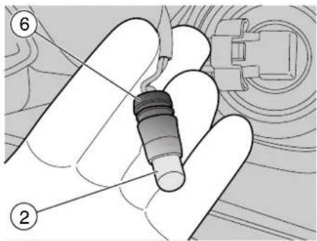 Technical diagram showing a mechanical component with numbered parts and labeled parts (2 and 6)