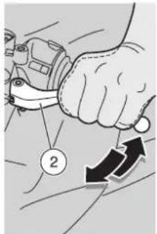 Diagram showing a hand holding a mechanical component with numbered callouts and directional arrows indicating motion or movement.