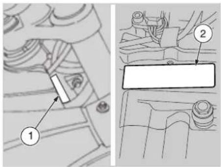 Technical diagram showing mechanical assembly with labeled parts 1 and 2