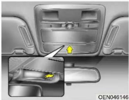 Interior view of a car dashboard and side door, showing a highlighted component with a yellow arrow (no text or symbols)