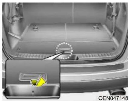 Interior view of a car showing the backrest tray and seat area with a yellow warning symbol (no text or symbols on the main subject)