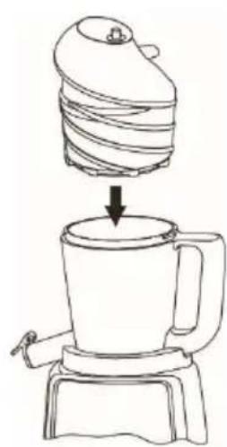 Line drawing of a blender with a spool of material being placed into a cup.