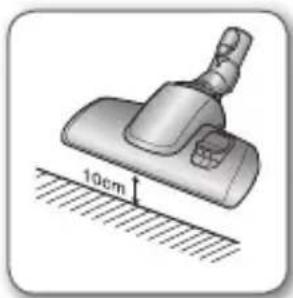 Illustration of a vacuum cleaner with 10cm height measurement on a surface (no text or symbols)