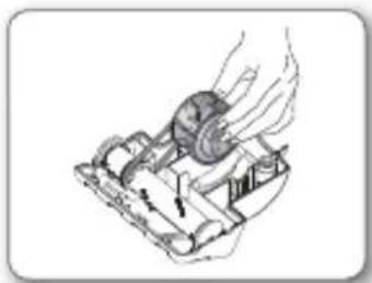 Diagram of a mechanical device with a hand operating it, showing internal components and motion arrows (no text or symbols)