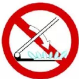 Prohibition sign with red circle and diagonal slash over grass, indicating no litter or trash