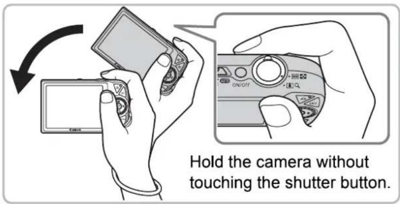 Hold the camera without touching the shutter button.