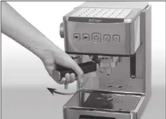 Hand using a espresso machine to press or adjust the cup (no visible text or symbols)
