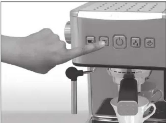 Close-up of a hand pressing a espresso machine with control buttons (no visible text or symbols)