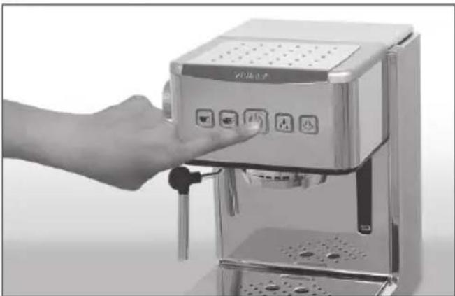 Hand operating a microhealer with control buttons and ports (no visible text or symbols)