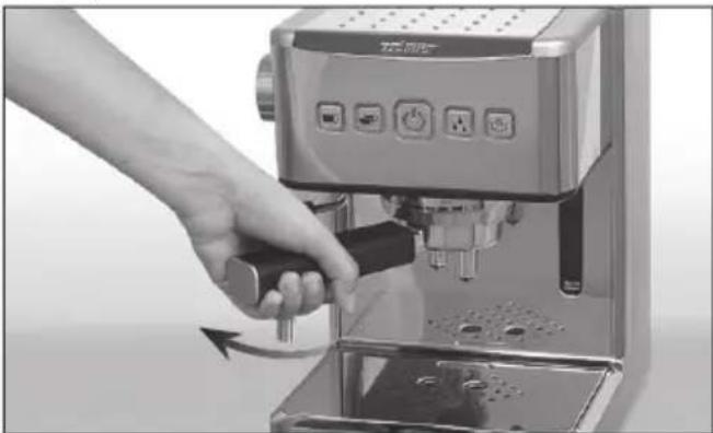 Hand using a espresso machine to press or adjust the cup (no visible text or symbols)