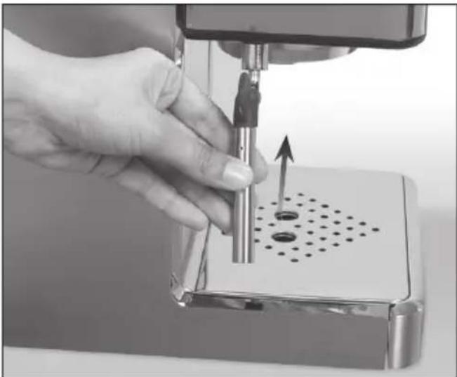 Close-up of a hand using a precision tool to press or install a mechanical component, with no visible text or symbols.