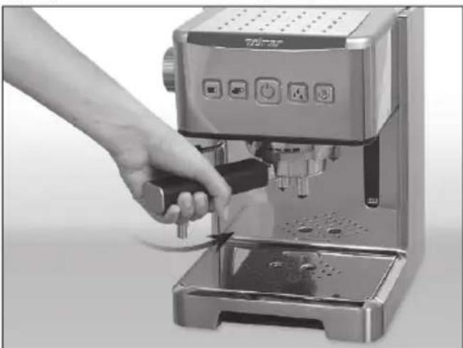 Hand using a standard espresso machine to press or adjust the cup (no visible text or symbols)