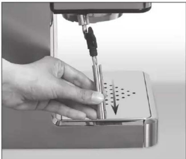 Close-up of a hand using a sewing machine to press down a metal component with a downward arrow indicating pressure (no text or symbols visible)
