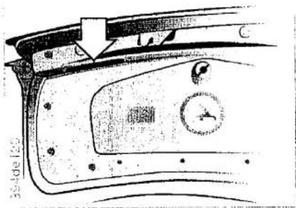 Technical diagram of a car door panel with labeled components and directional arrow