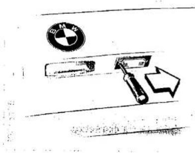 Diagram showing a car air condition control panel with BMW logo and directional arrow indicating airflow or movement.