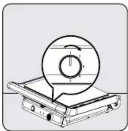 Technical diagram of a mechanical device with a circular component and rotation arrow (no text or symbols)