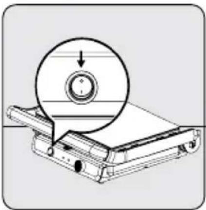 Technical illustration of a mechanical device with a circular component and an arrow indicating direction (no text or symbols)