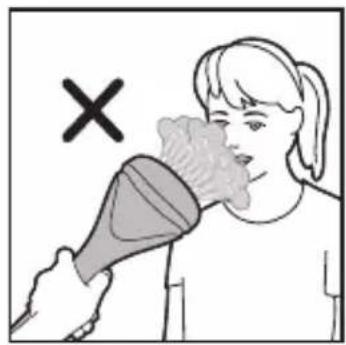 Illustration showing a person using a hairdryer with a cross symbol indicating rejection or absence of hair.