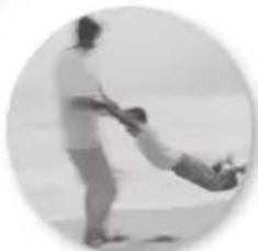 Black-and-white photo of a person pushing a baby (no text or symbols visible)