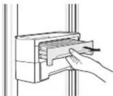 Line drawing of a hand inserting a component into a device (no text or symbols)