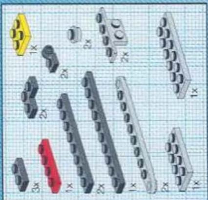 Collection of 3D-printed mechanical components on grid paper, no text or symbols visible