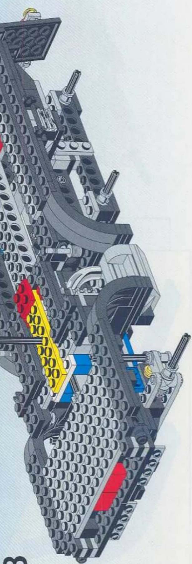 Cross-sectional diagram of a mechanical assembly with LEGO blocks and internal components (no visible text or symbols)