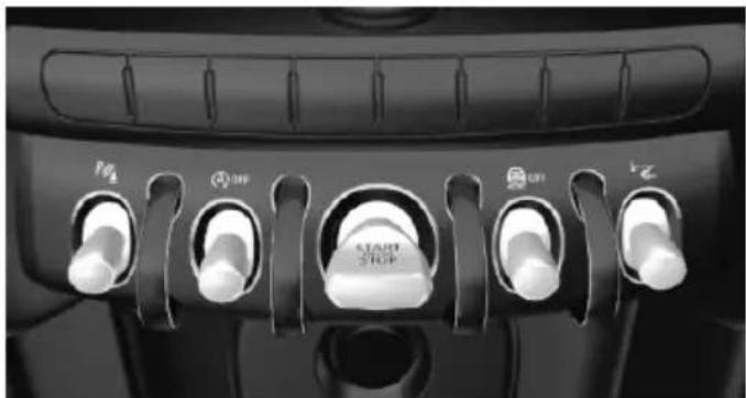 Close-up of a car dashboard with five rotary switches labeled M1, M2, M3, M4, M5 (no readable text beyond labels)