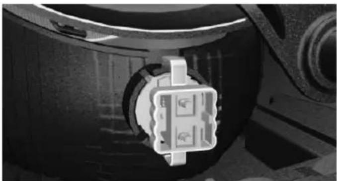Close-up of a mechanical component with a central connector and circular housing (no visible text or symbols)