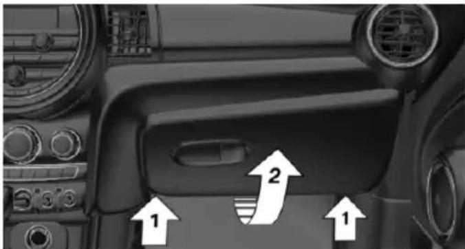 Interior view of a car dashboard with directional arrows and labeled parts (no readable text or symbols)