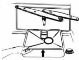 Illustration of a hand using a tool to lift a cylindrical object into a tray (no text or symbols visible)