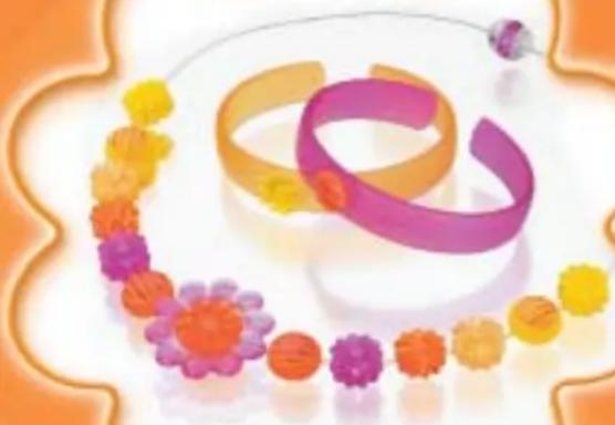 Illustration of a decorative arrangement featuring colorful flower-like patterns and two interlocked rings (no text or symbols)