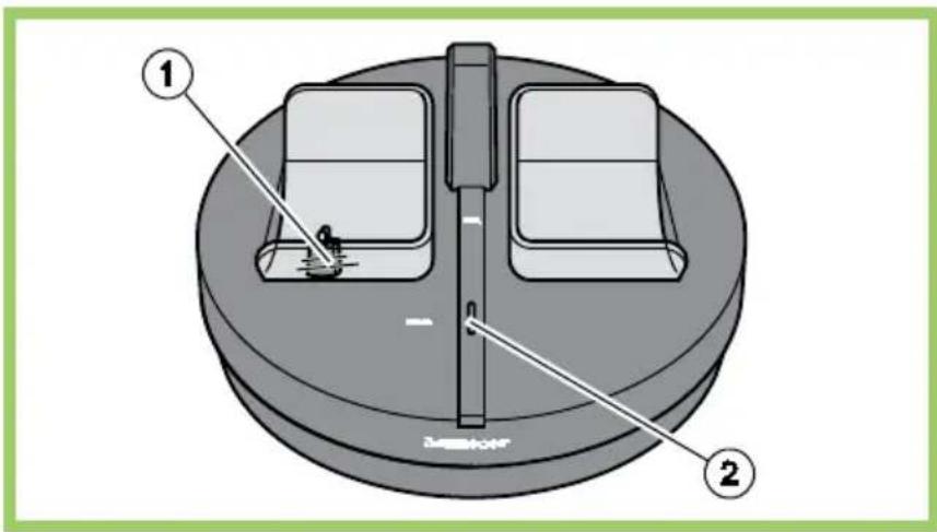 Diagram of a mechanical device with labeled parts, showing two components and a central shaft.
