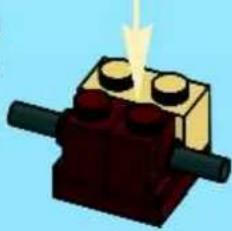 Illustration of a LEGO brick with three legs and a central block, emitting a bright light (no text or symbols)