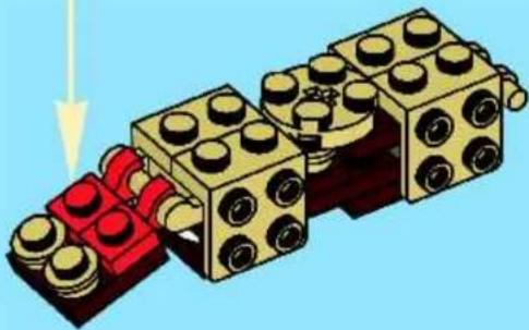 3D illustration of a LEGO structure with red and gold components, no text or symbols present