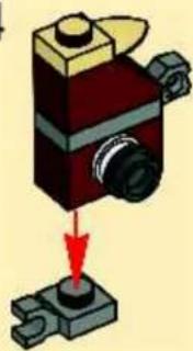 Mechanical component diagram showing a red and black assembly with a red arrow pointing to a base (no text or symbols)
